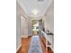 An entryway showcasing a hardwood floor, decoratively-designed rug, an open door, and a view of the front yard at 1225 Madison Green Dr, Fort Mill, SC 29715