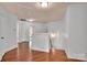 Hallway featuring hardwood floors, a staircase, and doors leading to different rooms at 1225 Madison Green Dr, Fort Mill, SC 29715