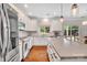Bright, spacious kitchen features stainless steel appliances, granite countertops, and hardwood floors at 1225 Madison Green Dr, Fort Mill, SC 29715