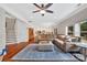 Open-concept living room with hardwood floors and views into the modern kitchen at 1225 Madison Green Dr, Fort Mill, SC 29715