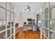 A lovely office space with hardwood floors, a ceiling fan, and a large wooden desk for optimal productivity at 1225 Madison Green Dr, Fort Mill, SC 29715