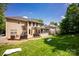 Spacious backyard featuring a deck, screened-in porch, lush lawn, and mature trees at 12416 Kane Alexander Dr, Huntersville, NC 28078