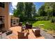 Inviting backyard with a wooden deck, patio furniture, and a well-maintained lawn, perfect for outdoor gatherings at 12416 Kane Alexander Dr, Huntersville, NC 28078