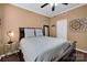 Relaxing bedroom with a full bed, wood floors, a ceiling fan and neutral decor at 12416 Kane Alexander Dr, Huntersville, NC 28078