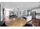 Open-concept living space showing kitchen, dining area, and living room with natural light and neutral tones at 12416 Kane Alexander Dr, Huntersville, NC 28078