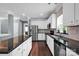 Well-equipped kitchen with stainless steel appliances, dark granite countertops, and ample white cabinetry at 12416 Kane Alexander Dr, Huntersville, NC 28078