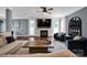 Spacious living room featuring a stone fireplace, hardwood flooring, and stylish decor at 12416 Kane Alexander Dr, Huntersville, NC 28078