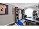 Bright home office featuring a large desk, themed decor, shelving and ample natural light from a large window at 12416 Kane Alexander Dr, Huntersville, NC 28078