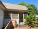 Close-up of screened porch entry with wooden deck and railings at 125 Hunter St, Salisbury, NC 28144