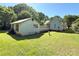 Home's backyard with building structure in back; lawn features bird bath at 125 Hunter St, Salisbury, NC 28144