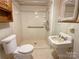 Accessible bathroom featuring walk-in shower with grab bars and vintage fixtures at 125 Hunter St, Salisbury, NC 28144