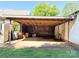 View of the spacious carport filled with supplies and materials at 125 Hunter St, Salisbury, NC 28144