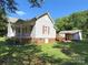 Side exterior view of home with a well-manicured lawn and carport at 125 Hunter St, Salisbury, NC 28144