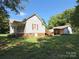 Exterior view showcasing a charming house and a detached carport at 125 Hunter St, Salisbury, NC 28144
