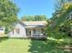 Charming single-story home with a covered porch, surrounded by lush greenery at 125 Hunter St, Salisbury, NC 28144