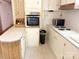 View of the kitchen area showcasing vintage countertops and stainless steel oven at 125 Hunter St, Salisbury, NC 28144