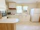 Vintage kitchen with oven, refrigerator, and retro countertops at 125 Hunter St, Salisbury, NC 28144
