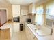 View of the kitchen area showing the sink, oven, and small window at 125 Hunter St, Salisbury, NC 28144