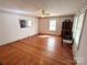 Bright and spacious living room with beautiful hardwood floors, ceiling fan, and plenty of natural light at 125 Hunter St, Salisbury, NC 28144