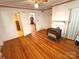 Cozy living room featuring hardwood floors, fireplace, natural light, and vintage decor at 125 Hunter St, Salisbury, NC 28144