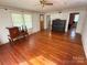 Bright and spacious living room with beautiful hardwood floors, ceiling fan, and plenty of natural light at 125 Hunter St, Salisbury, NC 28144
