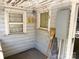 Enclosed porch space with peeling paint and electrical box at 125 Hunter St, Salisbury, NC 28144