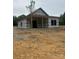 New construction home shows an inviting covered front porch at 128 Loblolly Dr, Mount Gilead, NC 27306