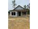 Unfinished home featuring a covered front porch, ready for your custom touches at 128 Loblolly Dr, Mount Gilead, NC 27306