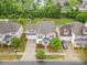 Overhead view of a two-story home with a well-manicured front yard and a driveway at 12832 Heath Grove Dr, Huntersville, NC 28078