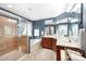 Bright bathroom showcases a glass-enclosed shower, soaking tub, double vanity, and soft neutral accents at 12832 Heath Grove Dr, Huntersville, NC 28078