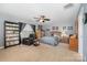 Cozy bedroom featuring a ceiling fan, carpet, and neutral gray wall paint at 12832 Heath Grove Dr, Huntersville, NC 28078