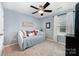 Comfortable bedroom with a daybed, soft lighting, and relaxing decor for a peaceful atmosphere at 12832 Heath Grove Dr, Huntersville, NC 28078