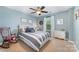 Bedroom featuring neutral-colored walls, a ceiling fan, and a rocking chair at 12832 Heath Grove Dr, Huntersville, NC 28078