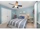 Light-filled bedroom with a ceiling fan, and neutral-colored walls at 12832 Heath Grove Dr, Huntersville, NC 28078