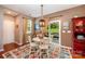 Cozy breakfast nook with hardwood floors and sliding door access to outdoors at 12832 Heath Grove Dr, Huntersville, NC 28078