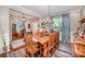 Dining room featuring wood table, chandelier and beautiful curtains at 12832 Heath Grove Dr, Huntersville, NC 28078
