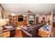 Warm living room with fireplace, built-in shelving and plenty of seating at 12832 Heath Grove Dr, Huntersville, NC 28078