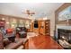 Comfortable living room with fireplace, built-in shelving, and plush seating at 12832 Heath Grove Dr, Huntersville, NC 28078