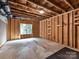 Unfinished basement with a window offers a blank canvas for future living space at 129 Overlook Ridge Ln, Davidson, NC 28036