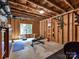 Unfinished basement with exposed ceiling set up with an excercise area with weights at 129 Overlook Ridge Ln, Davidson, NC 28036
