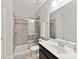 Nicely tiled bathroom featuring a glass shower, toilet, and a sink with modern fixtures at 129 Overlook Ridge Ln, Davidson, NC 28036