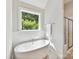 Luxurious bathroom featuring a freestanding soaking tub with a garden view at 129 Overlook Ridge Ln, Davidson, NC 28036