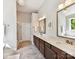 Elegant bathroom with double vanity, stone countertops, and stylish tile flooring at 129 Overlook Ridge Ln, Davidson, NC 28036