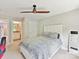 Bedroom featuring a soft bed, a modern fan, and a peek into an attached bathroom at 129 Overlook Ridge Ln, Davidson, NC 28036