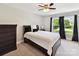 Comfortable bedroom featuring neutral walls, carpet, and a window with views of the outdoors at 129 Overlook Ridge Ln, Davidson, NC 28036