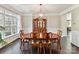Spacious dining room with wood floors, classic furnishings, and natural light at 129 Overlook Ridge Ln, Davidson, NC 28036