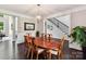 Formal dining room with a wooden table, elegant chairs, and stylish chandelier at 129 Overlook Ridge Ln, Davidson, NC 28036