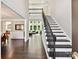 Elegant foyer with a staircase, hardwood floors, and abundant natural light at 129 Overlook Ridge Ln, Davidson, NC 28036