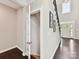 View of a hallway, open closet, front door and elegant staircase at 129 Overlook Ridge Ln, Davidson, NC 28036