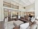 A stylish living room space featuring tall ceilings, hardwood floors, and an open concept feel at 129 Overlook Ridge Ln, Davidson, NC 28036
